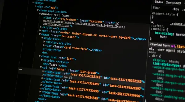 Kod HTML z linkiem do pliku CSS Bootstrap. To pokazuje, bootstrap to framework ułatwiający tworzenie stron.